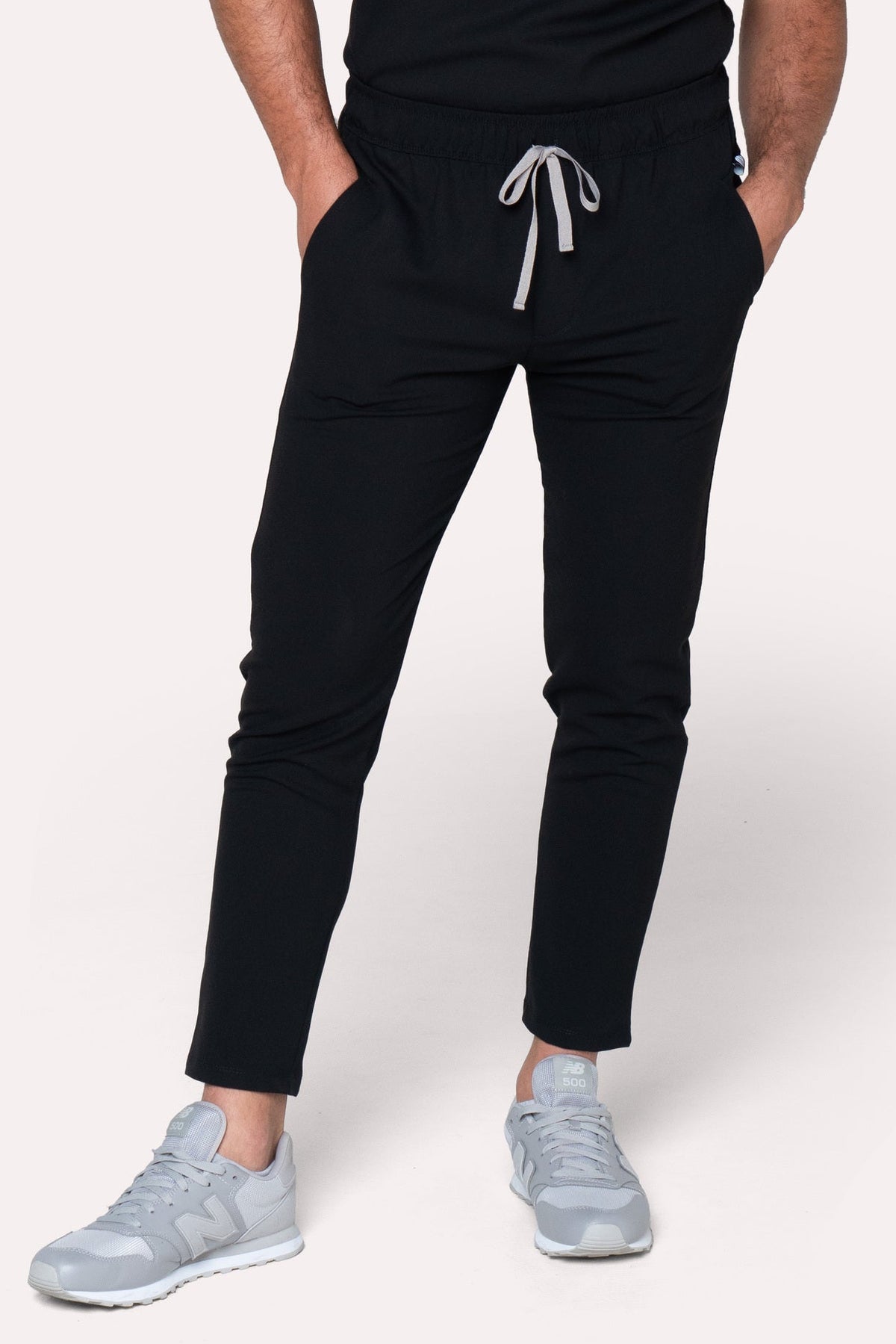 Front view of Fresh Black Scrub Pants showing the jogger fit and drawstring waist