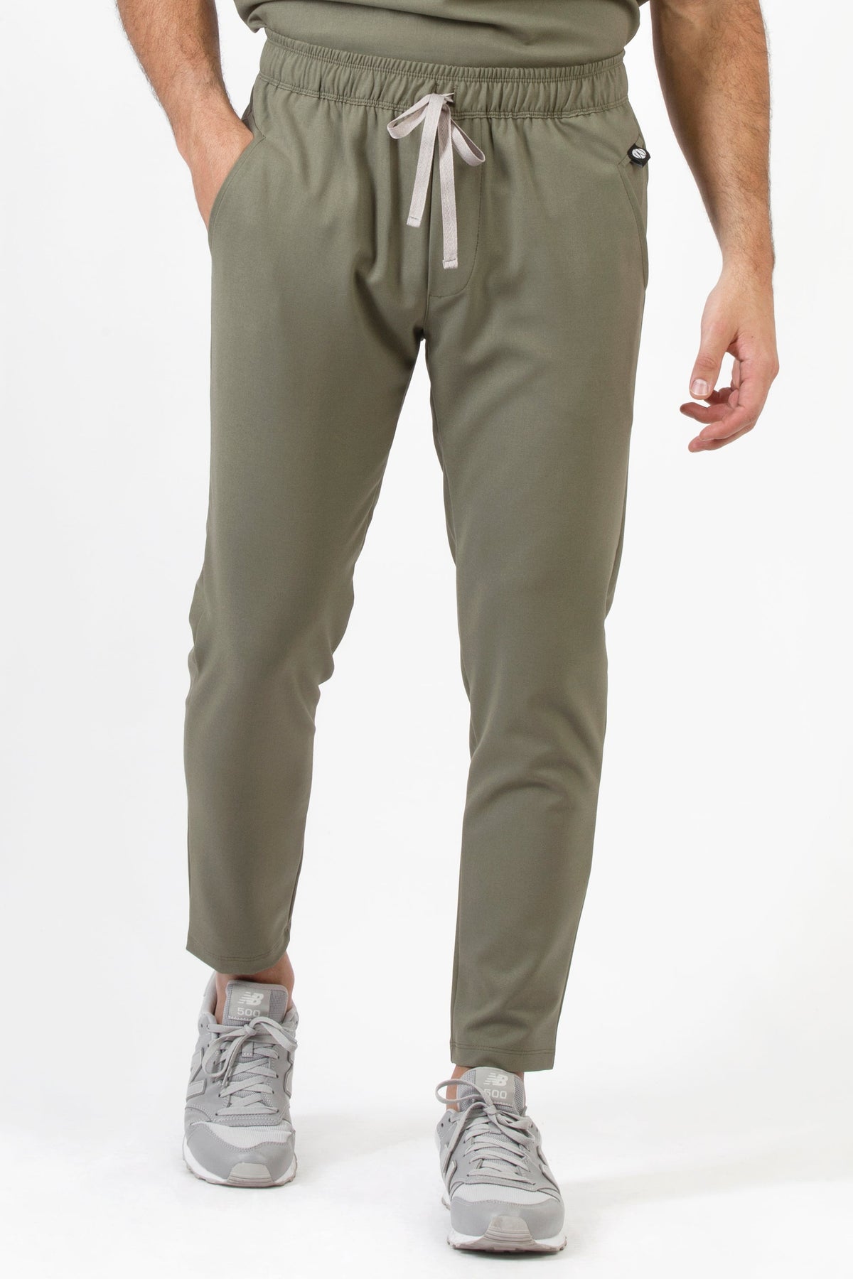 Front view of Fresh Olive Scrub Pants showing the jogger fit and drawstring waist