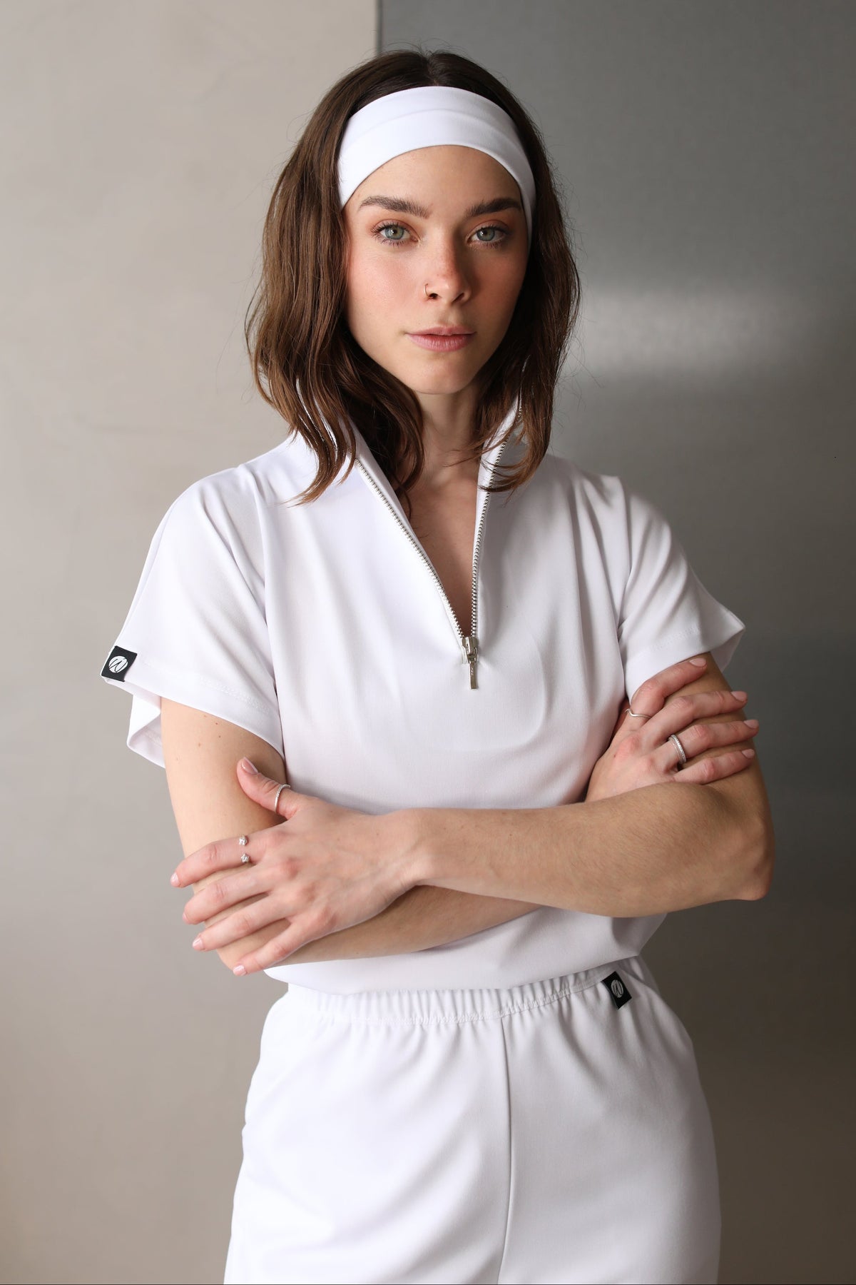Front view of Victory Crystal White Scrub Top showing the relaxed fit