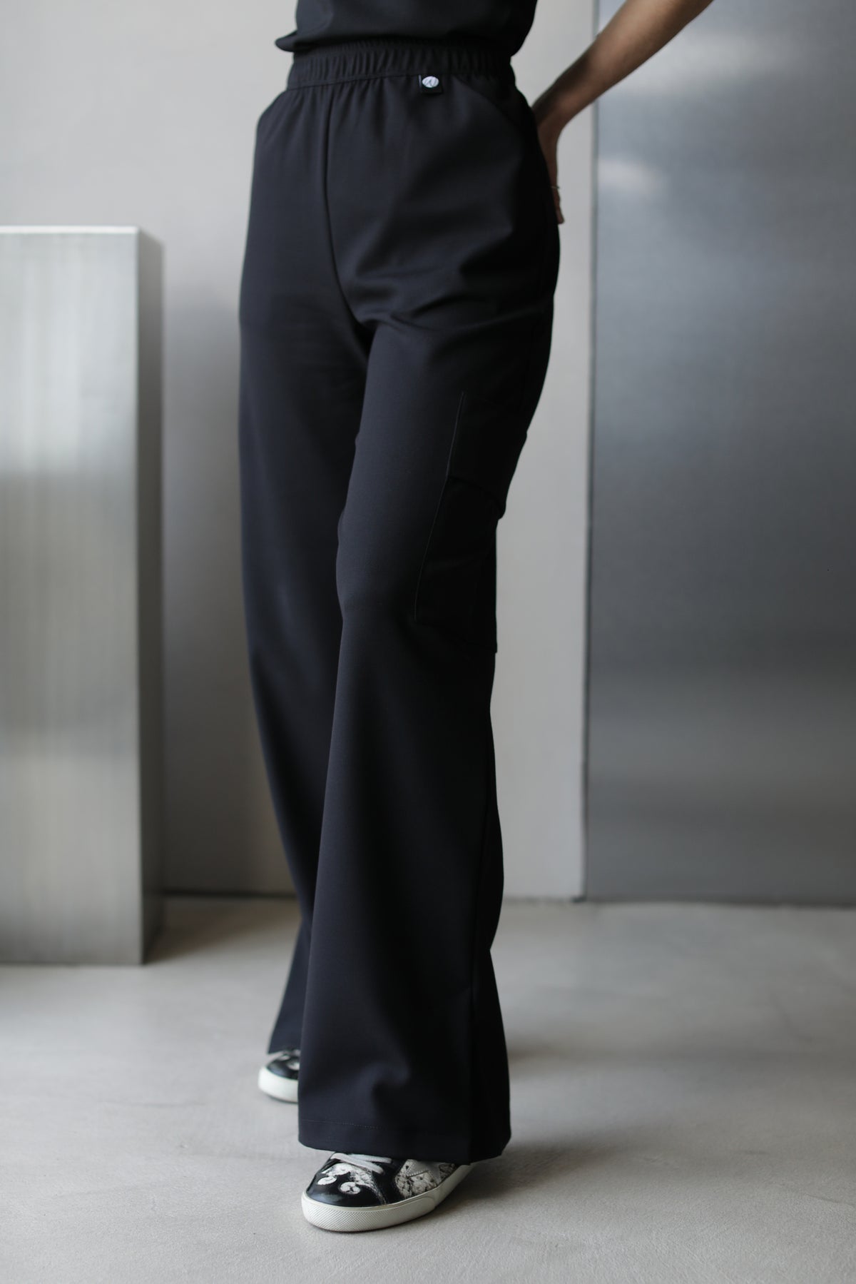 Victory Black Scrub Top styled with matching black scrub pants