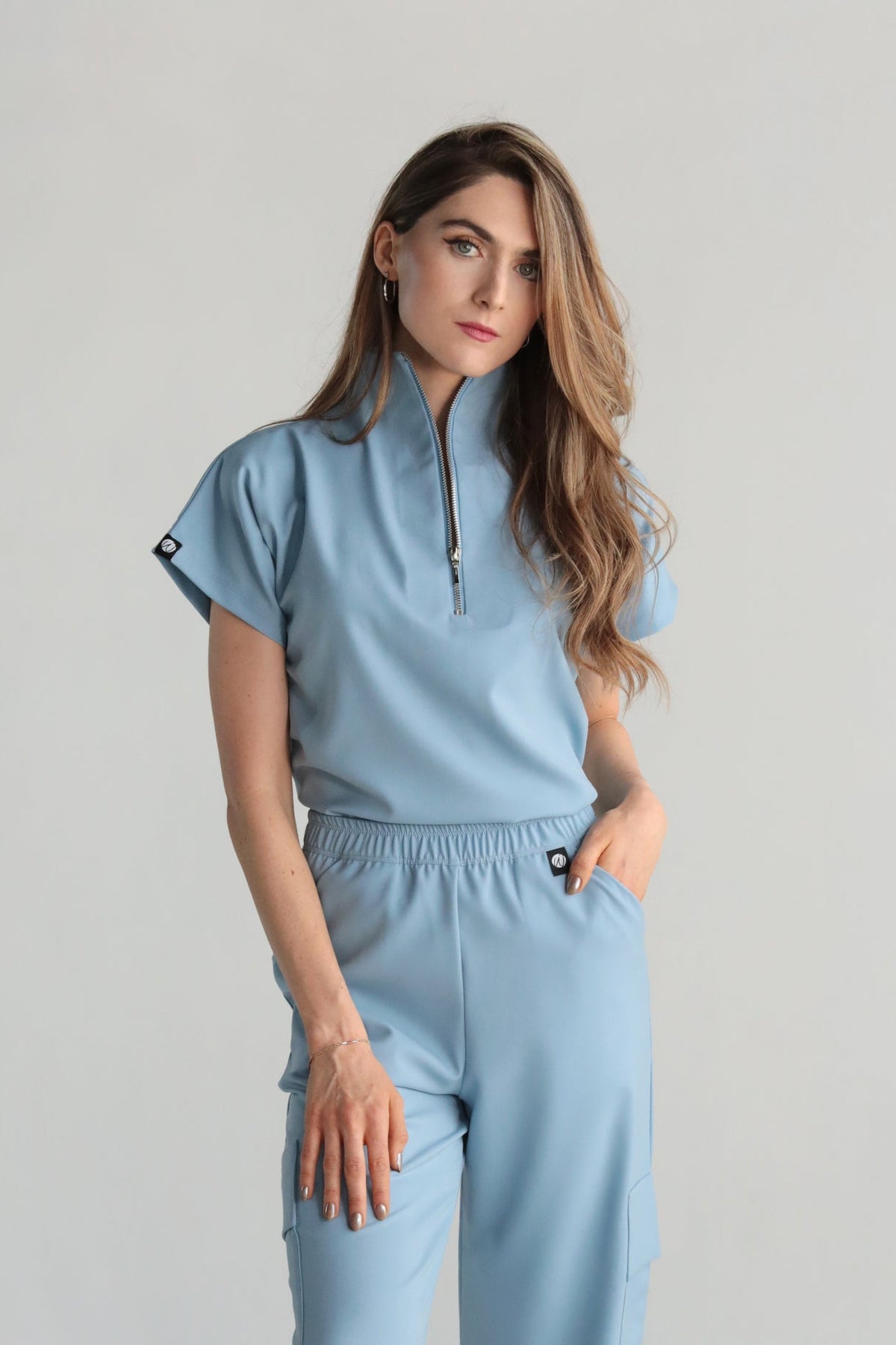 Front view of Victory Dream Blue Scrub Top showing the relaxed fit