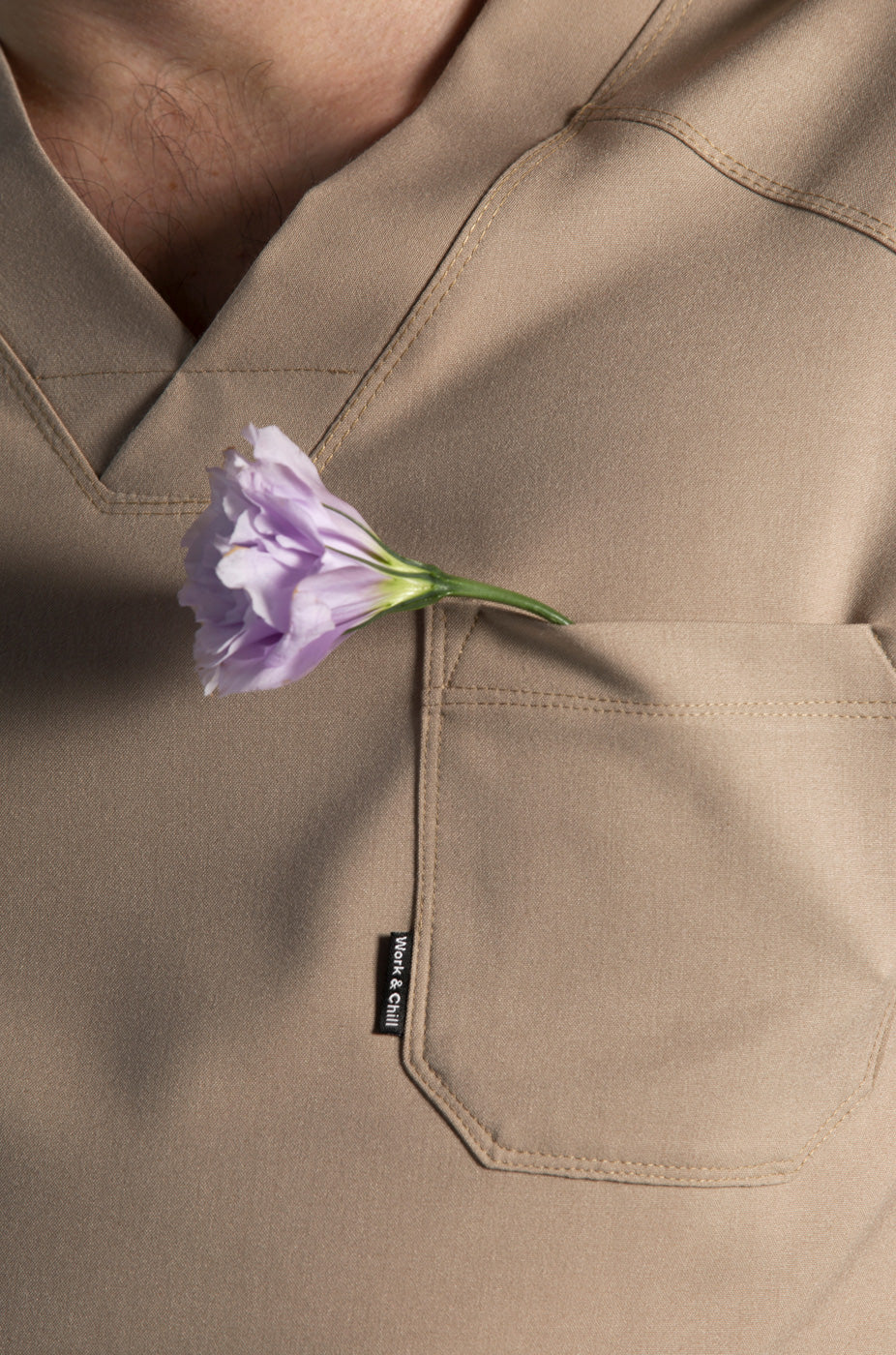 Close-up of Fresh Natural Scrub Top showing the chest pocket detail
