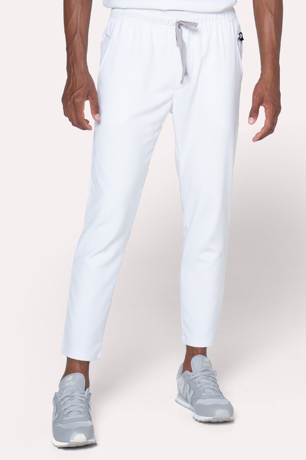 Front view of Fresh White Scrub Pants showing the jogger fit and drawstring waist