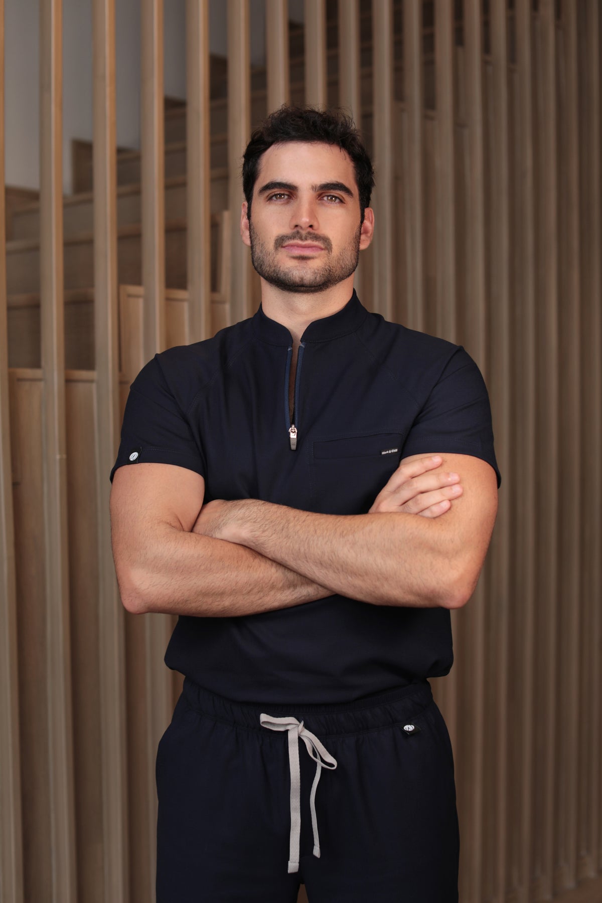 Man wearing Harry Navy Scrub Top by Work & Chill