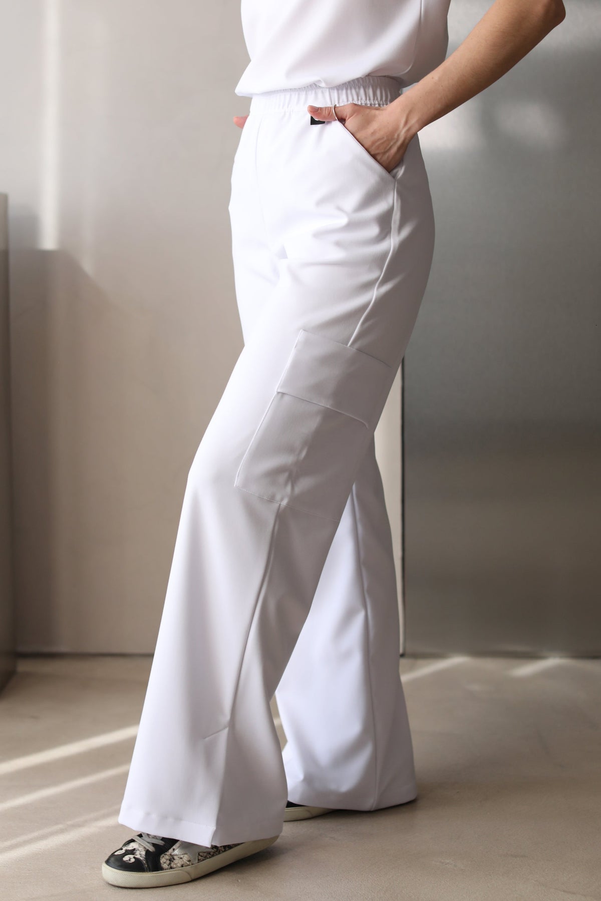 Front view of Kate Crystal White Scrub Pants showing the wide-leg fit