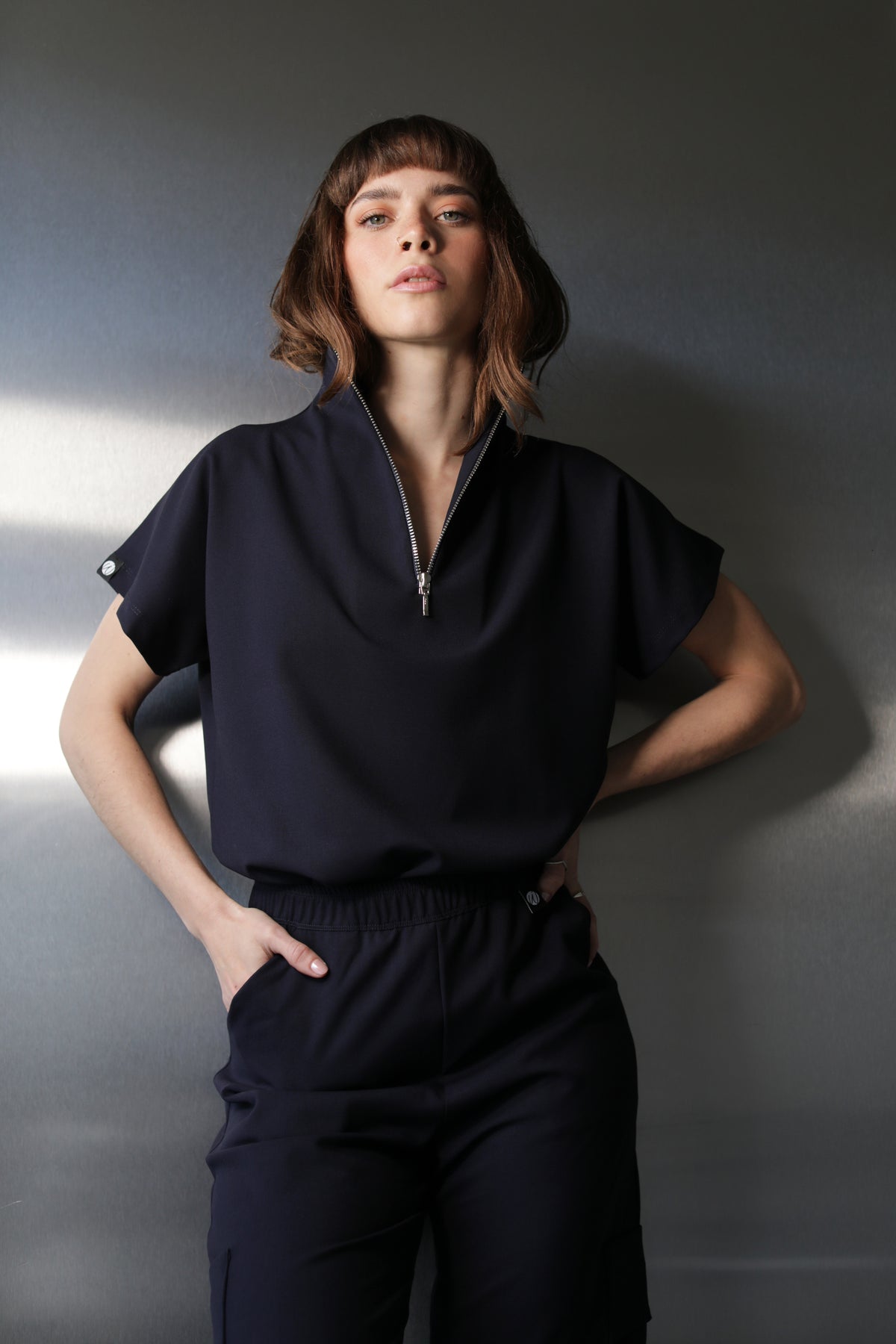 Front view of Victory Navy Scrub Top showing the relaxed fit